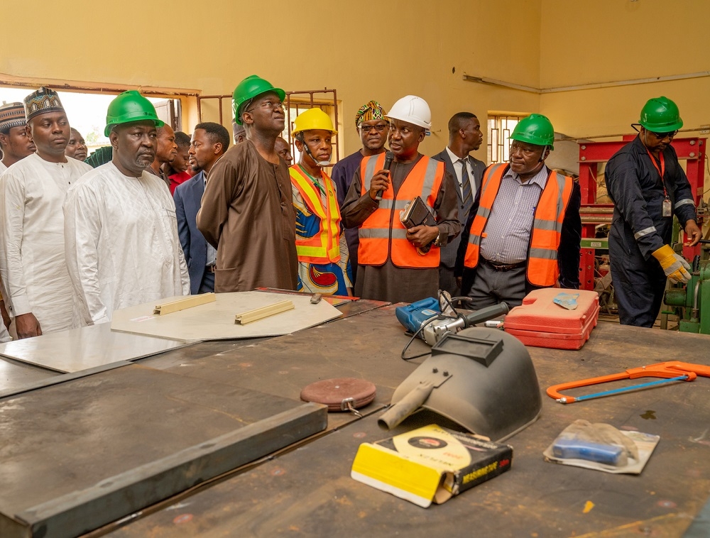Hon  Minister of Works   Housing  Mr Babatunde Fashola SAN 2nd left   Minister of State in the Ministry  Engr  Abubakar Aliyu  left  being conducted round by the Director Engineering Services  Engr  Julius Olurinola   and Director  Central Workshops   Equipment  Engr  Felix Ebuzoeme  3rd right  during the inspection of the Federal Ministry of Works   Housing s Engineering Centre comprising the Zonal Workshop   Electrical  Mechanical Training School in Kuje  Abuja on Friday  13th September 2019
